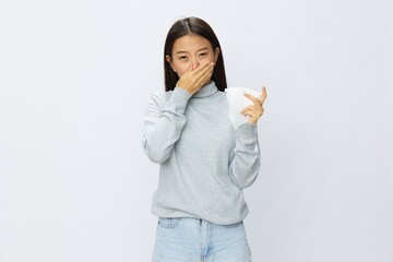 Asian woman holding hand with handkerchief and coughing up flu and cold, stuffy nose viral disease covid 19 white background