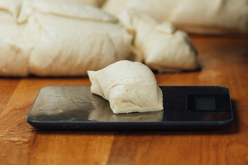 Weighing dough on a scale