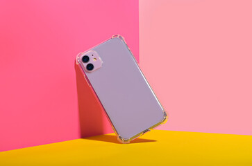 Purple iPhone 11 and 14 Plus in clear phone case, bright and colorful phone case mock up 