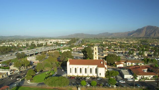 Aerial Forward Panning Shot Of Famous Catholic Church On Sunny Day Against Clear Sky During Sunny Day - Camarillo, California