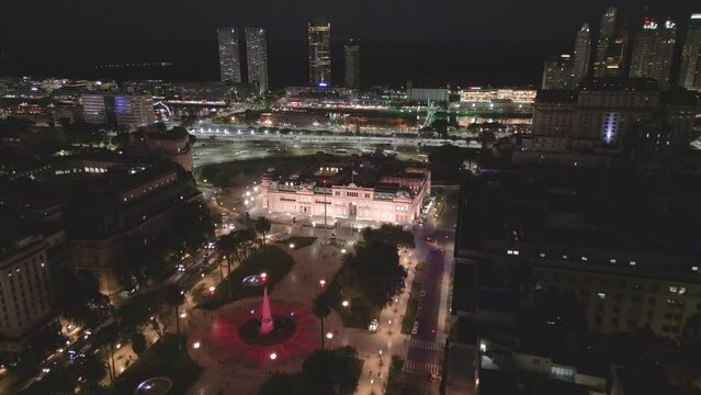 Aerial Drone Fly Above Pink House and Plaza de Mayo at Night Buenos Aires City Argentina Microcentro Business Center, Nighttime