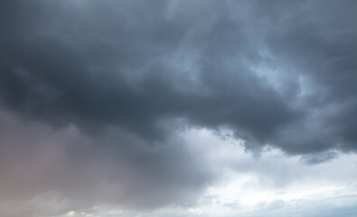 Fototapeta premium Rain clouds at sunset as background