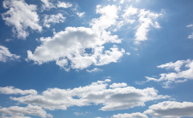 Fototapeta na wymiar White clouds on the blue sky