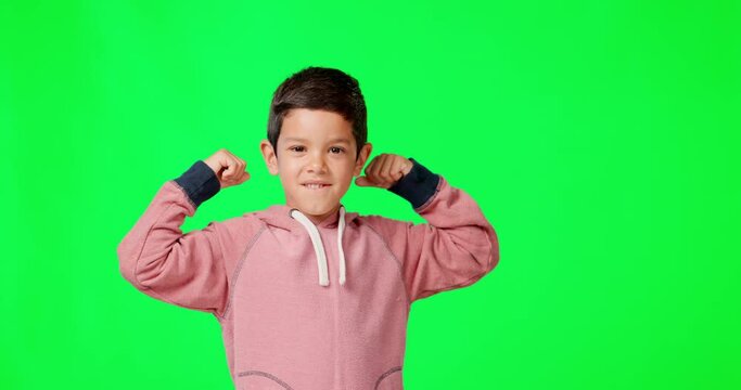Face, kid and flexing muscle on green screen in studio isolated on a background mockup. Portrait, strong smile and happiness of confident child or boy with strength from exercise, power and biceps.
