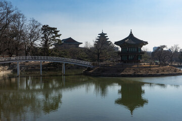 Fototapeta na wymiar Gyeongbokgung Palace and Hyangwonjeong Pavilion with Chwihyang bridge during winter morning at Jongno-gu , Seoul South Korea : 8 February 2023