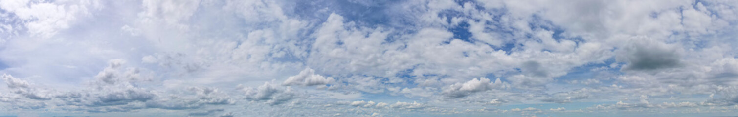 The contrast of the dark gray clouds against the blue sky provided a stunning backdrop for the panorama, Sky background.