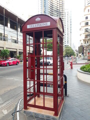 Red Telephone Booth on footpath