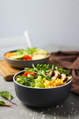Bowls with tasty and nutritious food, space for text