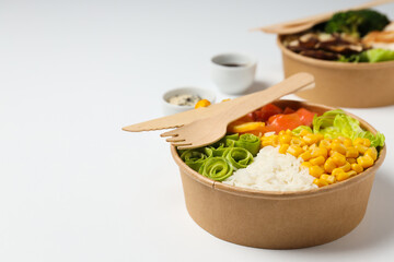 Bowls with tasty and nutritious food, space for text