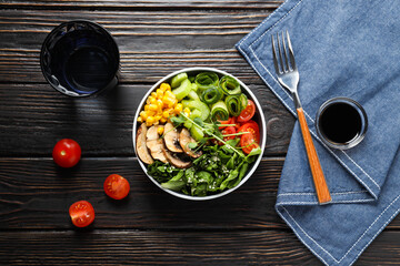 Bowl with tasty and nutritious food, top view