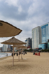 Gwangalli Beach and Gwangan Bridge in Busan during winter morning cloudy day at Suyeong-gu , Busan  South Korea : 9 February 2023