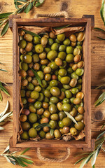 Ripe olives in wooden crate