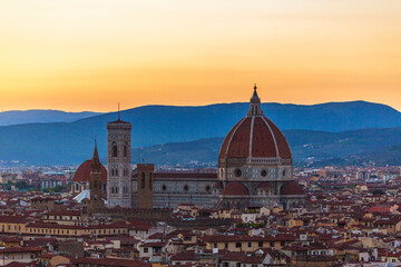 Fototapeta na wymiar Florence Cathedral at sunset and the mountains