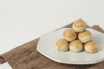 Kue nastar , This golden-brown treat is filled with a mouth-watering blend of buttery goodness and...