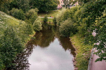 Fototapeta na wymiar Akerselva River in Oslo seen from Nybrua Bridge.