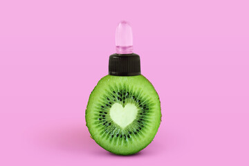 Heart shaped kiwi with cosmetc pump on pink background - Concept of kiwi benefits for skincare and beauty
