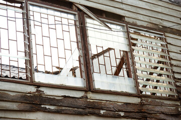 Storm-Damaged and Earthquake-Ravaged Broken House. Abandoned wooden house.
