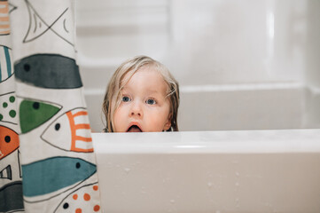 surprised girl in bath tub