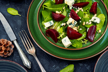 Salad with beet, blue cheese and pine nuts