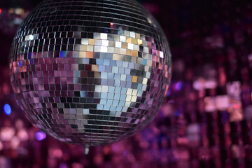 Mirror shiny ball on a pink background. Disco ball