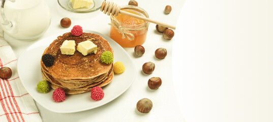 Freshly made pancakes with jam for breakfast