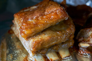 A piece of crispy lamb chops is being baked in the oven