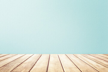 Empty wooden deck table and mint wallpaper background for present product.