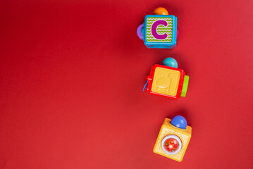 baby toys on red background