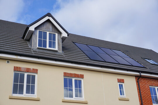 new housing roof top with solar panels. residential homes in city. property market image 
