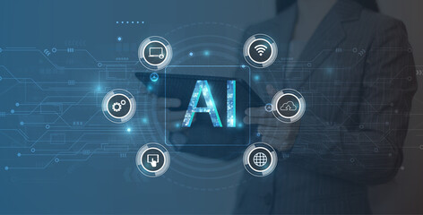 AI, Artificial Intelligence, Cloud Computing and Networks Concept. Businesswoman using mobile phone and laptop computer with IOT icons.