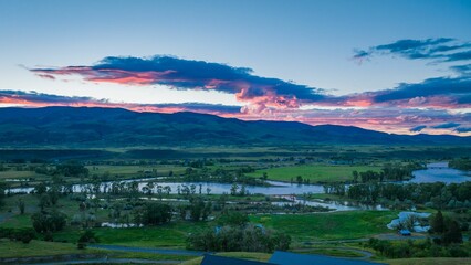 Aerial view of the Paradise Valley and Yellowstone River with gorgeous clouds above at sunset