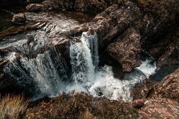 High-angle of waterfall formation by falling rivers from steep rocks in the Isle of Skye, Scotland