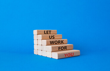 Let us work for you symbol. Wooden blocks with words Let us work for you. Beautiful blue background. Business and Let us work for you concept. Copy space.