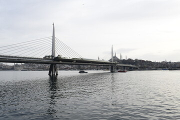 Long exposure. View of Haliç Metro Bridge connecting Azapkapı (Beyoğlu) and Unkapanı (Fatih) (Halic Metro Bridge). blue sky Istanbul Turkey