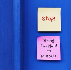 Two notes with handwritten text STOP! BEING SO HARD ON YOURSELF - overcome own worst critics,...