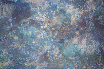 Multicolored background of decorative plaster with abstract spots. Unusual color wall texture with beautiful patterns, creative surface background. Finishing coating for building cladding.