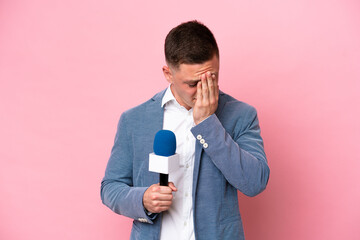 Young brazilian presenter man isolated on pink background with tired and sick expression