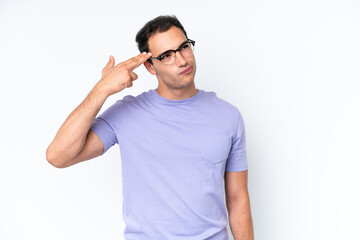 Young caucasian man isolated on white background with problems making suicide gesture