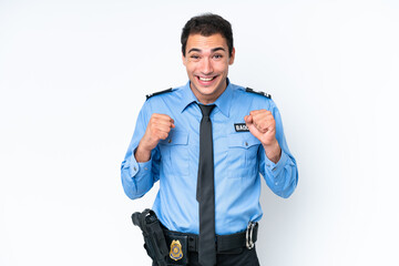 Young police caucasian man isolated on white background celebrating a victory in winner position
