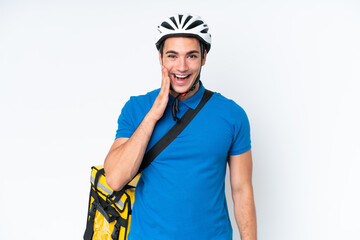 Young caucasian man with thermal backpack isolated on white background with surprise and shocked facial expression