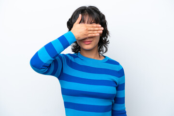 Young Argentinian woman isolated on white background covering eyes by hands. Do not want to see...