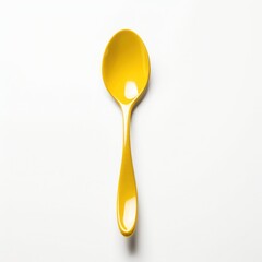 yellow spoon isolated on white background