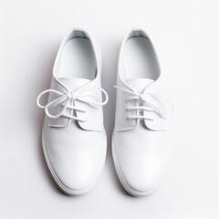 white pair of shoes on white background