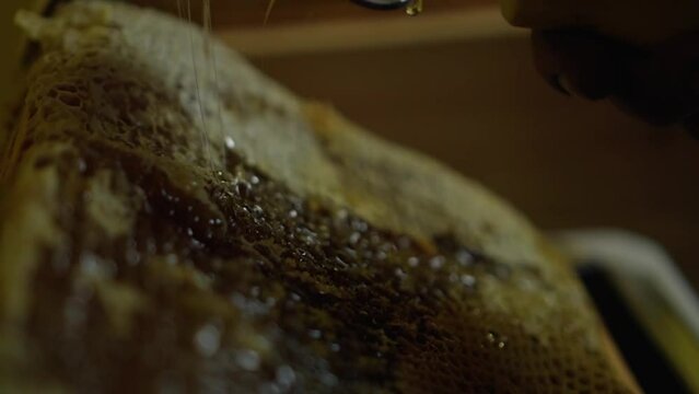 Close-up of an uncapping fork used to prepare the honeycomb