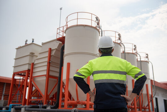 Workers Inspect A Large Wastewater Treatment Industry