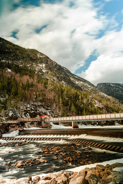 Vertical shot of a bridge over a river in a rural area in Ile Perrot, Quebec, Canada