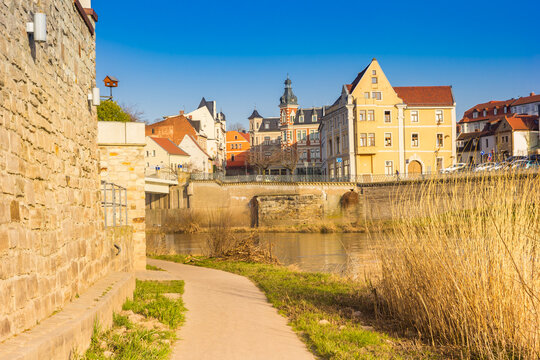 Walking path at the river bank of the Saale river in Bernburg, Germany