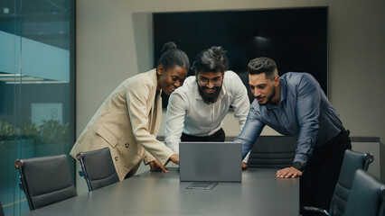 Diverse business partners colleagues people multiracial corporate group project team African woman and Indian Arabian men online work with laptop working with computer together united office teamwork