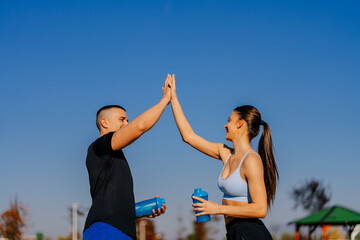 Couple giving high five each other
