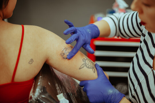Smearing a cream on the tattoo
